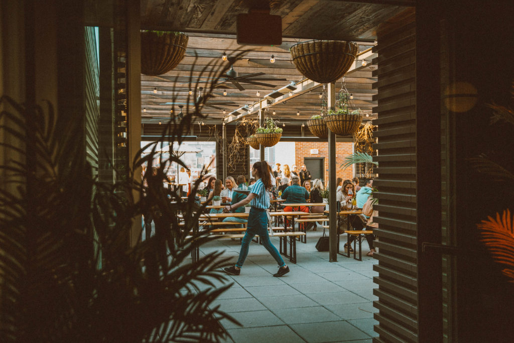 Bar entryway looking into cheerful people at our downtown KC hotel