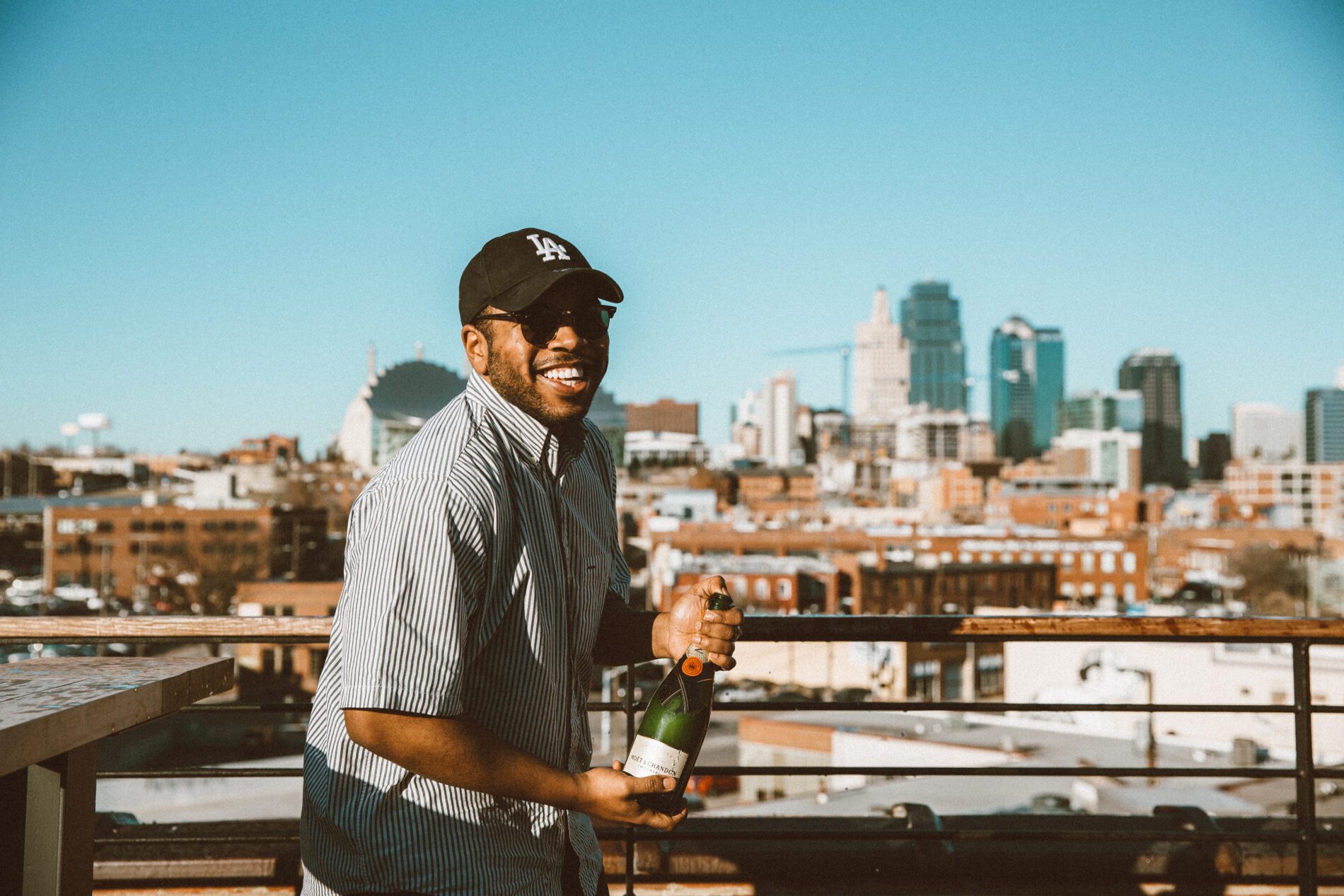 Person on top of Crossroads Roof with view of Kansas City