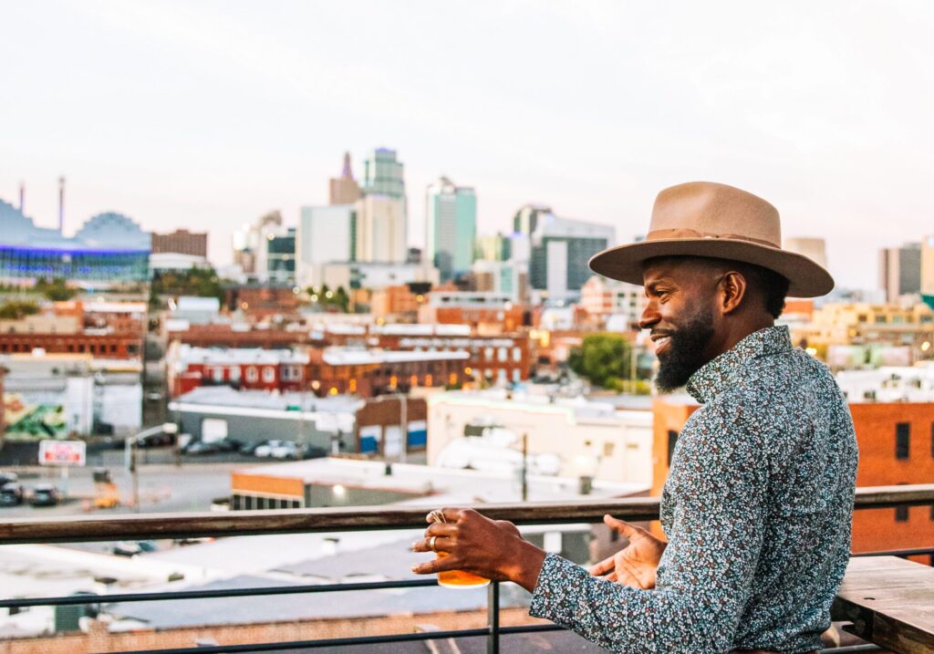 man with hat at the top of percheron bar