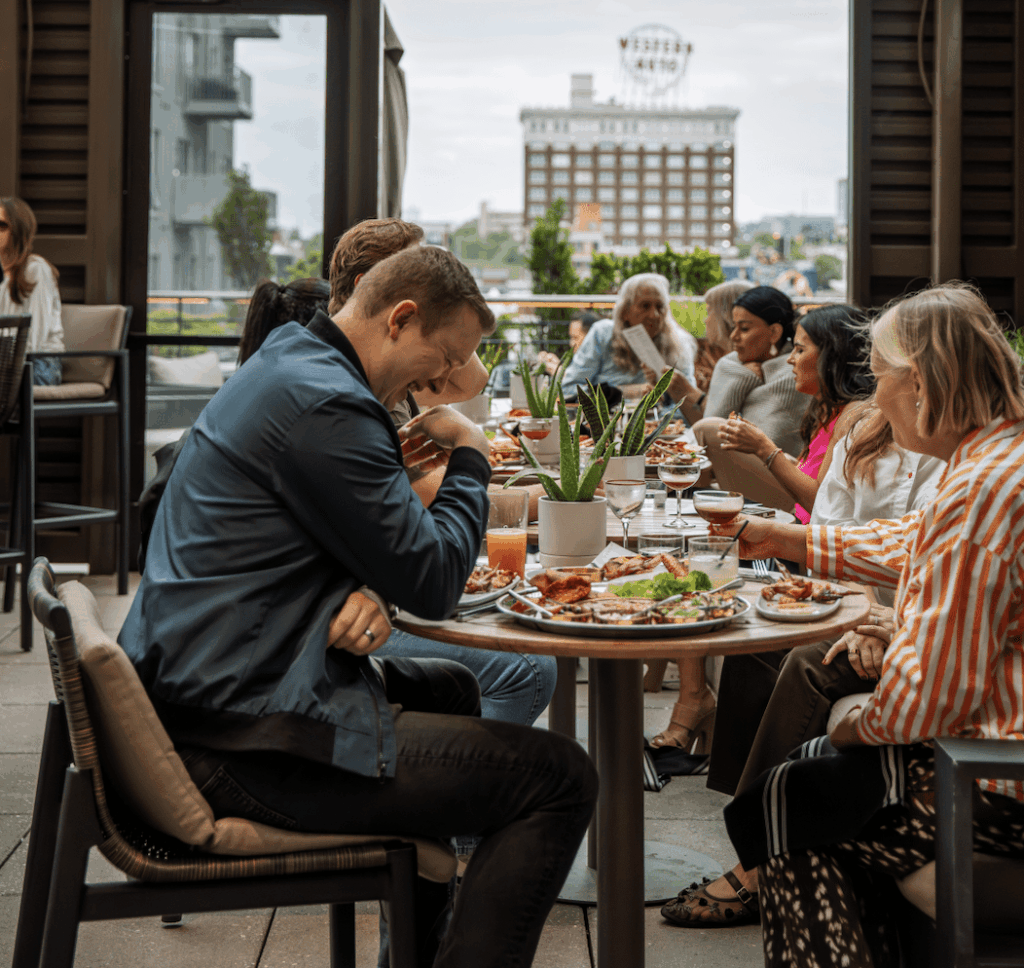 group of friends and family enjoying some drinks and food